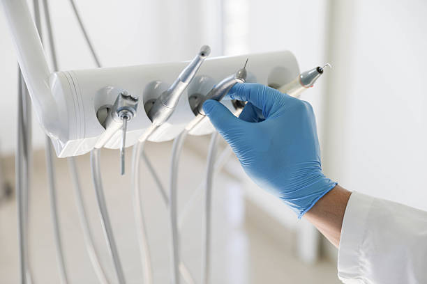 Professional Tooth Extraction technician working in Lenexa, KS